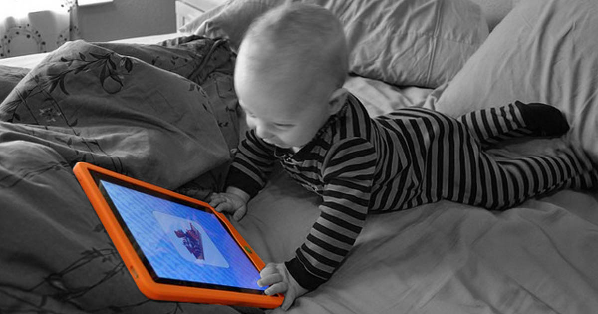 Young child glued to an iPad